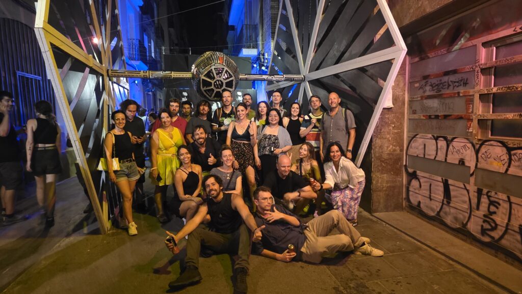 International group enjoying Las Fiestas de Gràcia 2025 in Barcelona – colorful street festival with decorations and nightlife