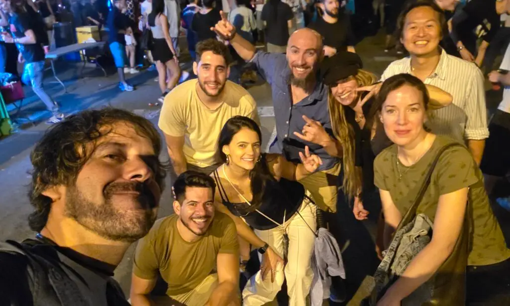International friends celebrating the third day of the Poblenou Festival 2025 in Barcelona, enjoying live music, dancing, and vibrant street parties.