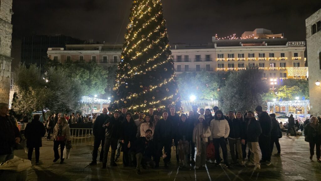 Group visiting the Gothic Quarter Christmas Market in Barcelona during a winter evening