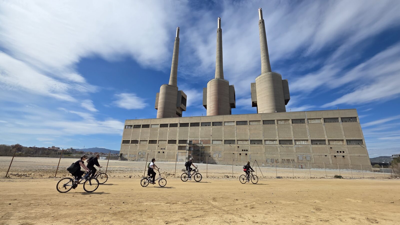 Group of friends with bicycles during a sunny ride to Premià de Mar near the beach