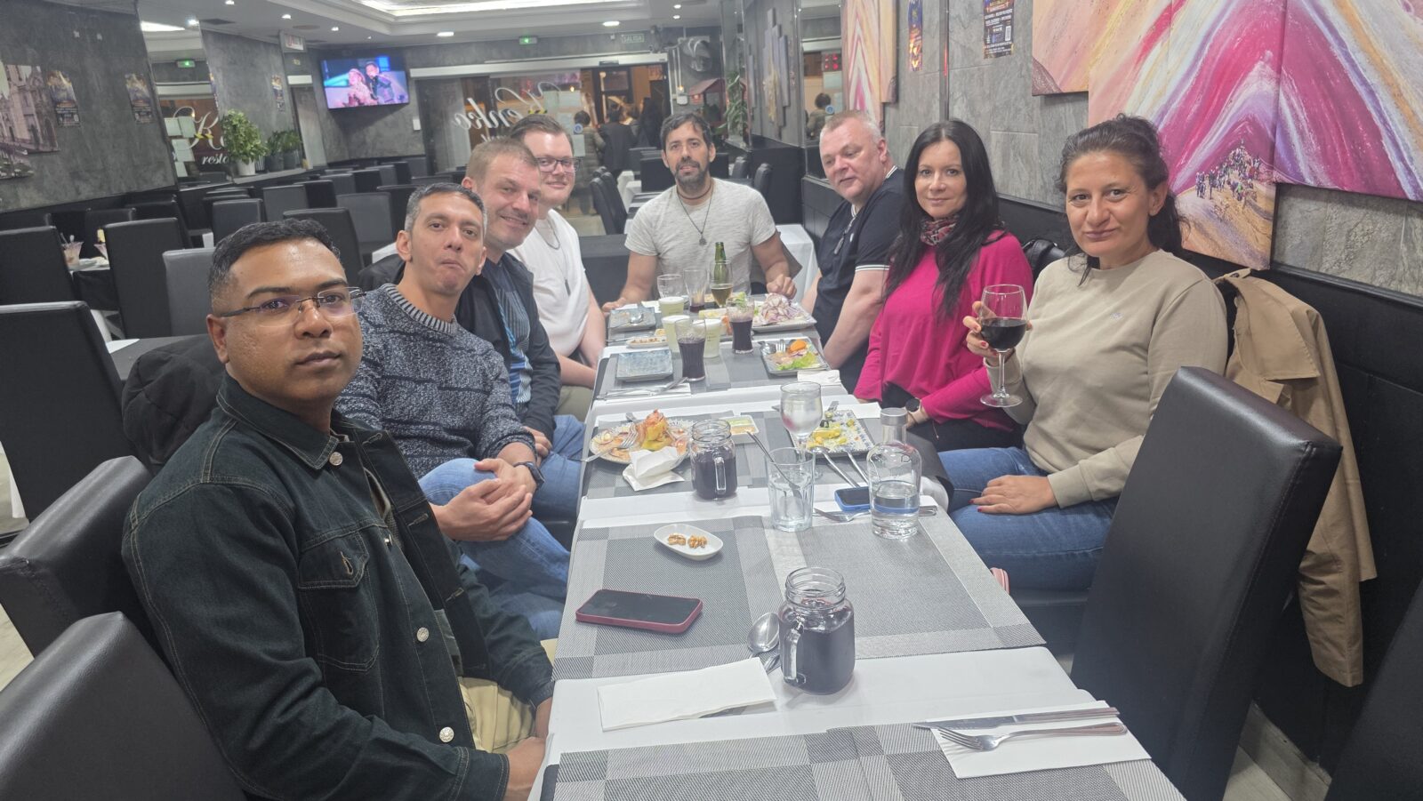 International group enjoying authentic Peruvian food at Kenko restaurant in Barcelona